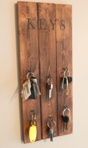Learn how to make this very quick and easy DIY hanging key holder. Stop all of the key clutter around your house and add a little décor at the same time.
